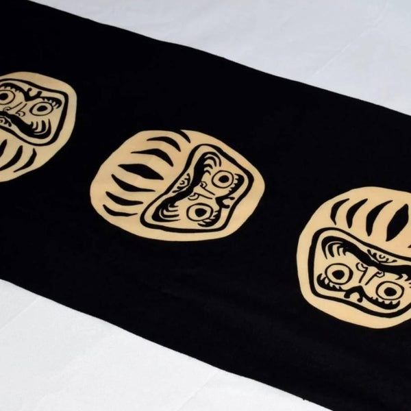 Kenema-Tenugui-Black-Daruma-Traditional-Hand-Dyed-Cloth-35-x-90cm-2-2025-06-03T12:54:49.024Z.jpg